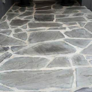 Grey stone leading to customer's front door